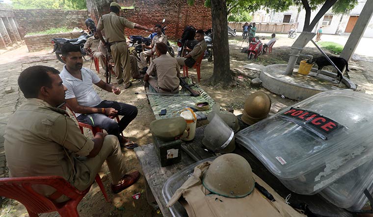 Tense wait: Police deployed in Makhi village, Unnao | Pawan Kumar