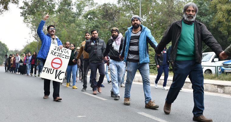 Strength in numbers: JNU Teachers’ Association members form a human chain to protest the attack on students at the university | Aayush Goel