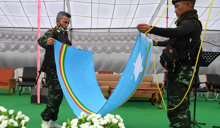 No flag of truce: NSCN(IM) members folding the separatist flag after an event at Camp Hebron | Salil Bera