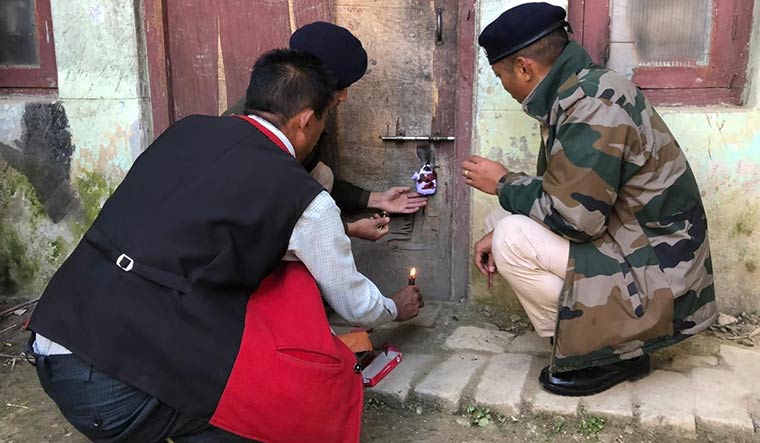 Enforcing calm: Security personnel sealing an unauthorised rebel camp.