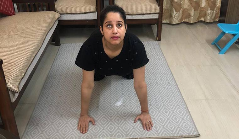 Hope and positivity: Swati Singh, in the third trimester of her pregnancy, is treading cautiously when it comes to practicing her asanas.