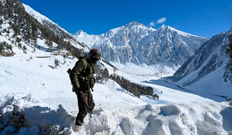 Winter woes: An Indian soldier near a mountain pass that connects Srinagar to Ladakh | AFP