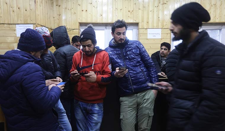 Data scarcity: Journalists at the media centre in Srinagar. Though 2G internet has been restored, the connectivity is poor | Umer Asif