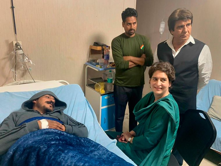 Fervent fighter: Congress general secretary Priyanka Vadra and Rajya Sabha member Raj Babbar visit Azad in a hospital. Azad suffers from polycythaemia, a condition marked by excess of red blood cells | PTI