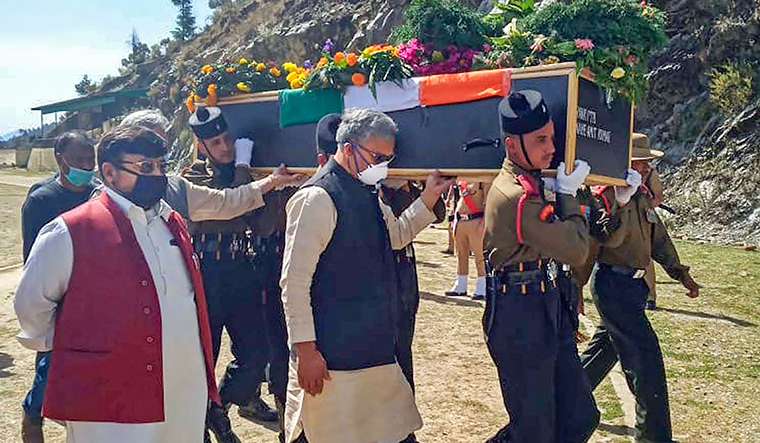 Farewell to a Hero: Uttarakhand Chief Minister Trivendra Singh Rawat shoulders the mortal remains of martyred jawan Amit Kumar at his native place in Pauri district 