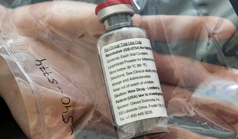 Drops of hope: A vial of remdesivir at a news conference about the start of a study into the drug in hamburg, germany | Reuters