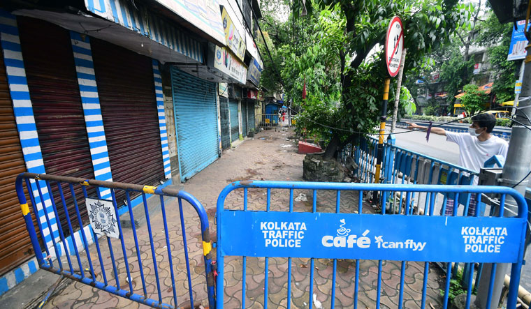 On alert: Police have shuttered a row of shops and blocked the pavement on Aurobinda Sarani in Kolkata |  Sayantan Ghosh