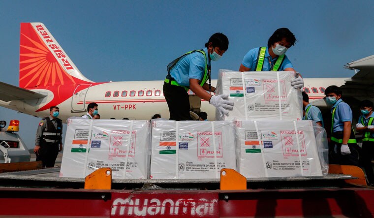 Neighbour’s favour: Workers unload cartons of India’s Covid-19 vaccine at the Yangon International Airport in Myanmar | AFP