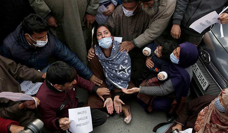 Seeking justice: Wife of Dr Mudasir Gul, who was killed in a gun battle, with her relatives during a protest in Srinagar | Reuters
