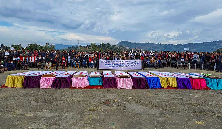 Tears of the hills: People attending the funeral of civilians killed by security forces in Mon district | AFP