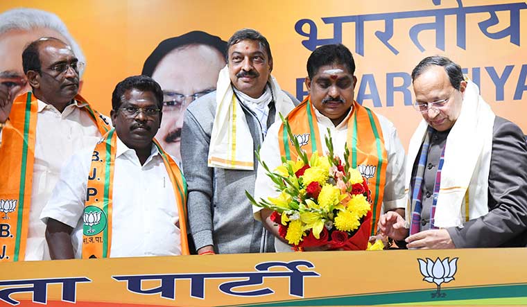 Changing colours: A. Namassivayam (second from right) and other leaders join the BJP in the presence of the party’s national general secretary Arun Singh in Delhi | Sanjay Ahlawat