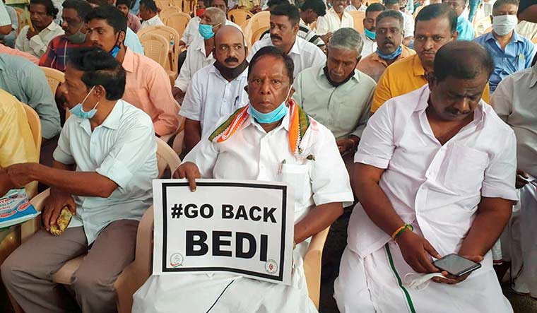 Uneasy relationship: Chief Minister V. Narayanasamy and ministers during their agitation against Lt Governor Kiran Bedi | PTI
