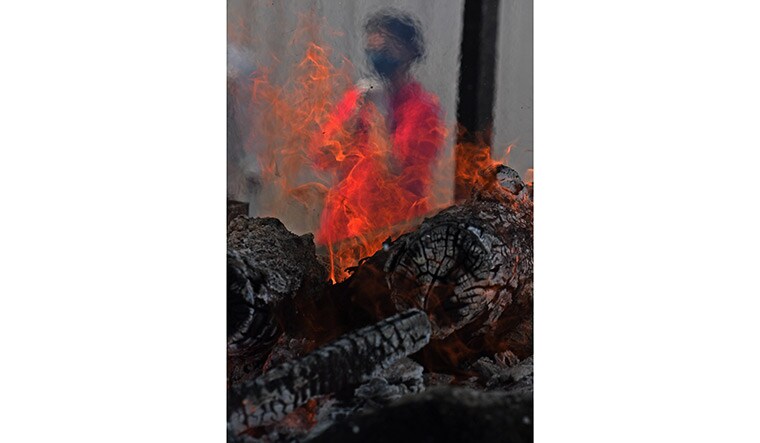 45-A-mass-cremation-of-people-died-new