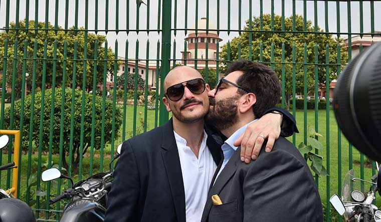 Equal rights: Hotelier and gay rights activist Keshav Suri, one of the petitioners in the Section 377 case,  kisses his partner after the Supreme Court verdict decriminalising homosexuality | Sanjay Ahlawat
