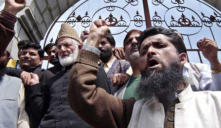 The hawk of the hurriyat: Syed Ali Shah Geelani (wearing cap) with supporters in Srinagar in 2004 | AP