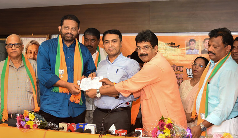 Open-door policy: Goa Chief Minister Pramod Sawant (centre) and state BJP president Sadanand Tanavade welcome Congress defectors in Panaji on September 14 | PTI