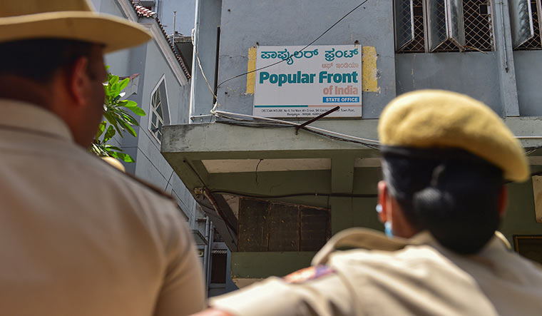 Keeping watch: Security personnel outside the PFI office in Bengaluru on September 22 | PTI