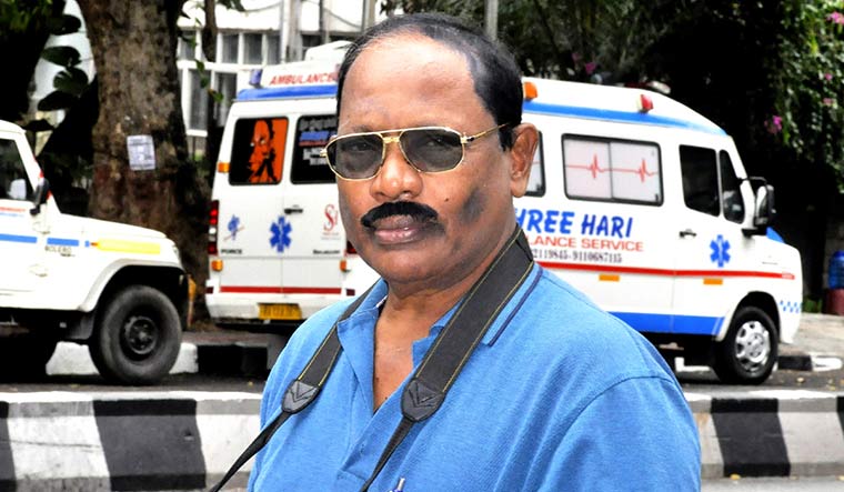 A. Nicholas, crime scene photographer | Nirmal Jovial