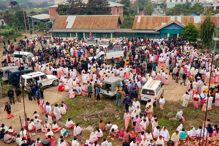 Unending strife: Family members arrive to claim the bodies of 13 people killed in a gunfight in a border village of Manipur on December 4. The Meitei-Kuki clashes have disrupted peace in the state for months | PTI