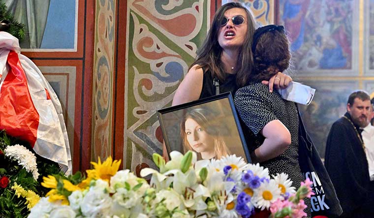Aggrieved and angry: Women react near the coffin of Ukrainian writer Victoria Amelina, 37, during her funeral service in Kyiv. Amelina was wounded and then died in a Russian missile strike in Kramatorsk that killed 12 people, including children | AFP