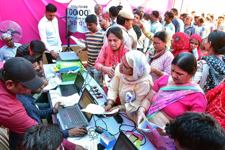 Healing touch: People at a Mehangai Rahat camp (price-rise relief camp) held in Bikaner | PTI