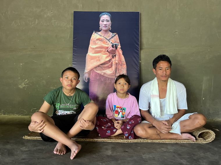 Endless loss: Ngangbam Ingo and his children, Rojiya and Mahesh, in front of a photo of his wife Surbala Devi, who was killed by a sniper’s bullet | Javed Parvesh