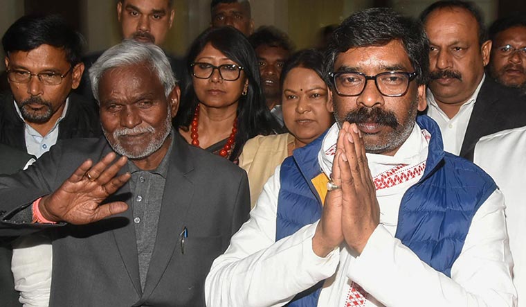 Tough times: Hemant Soren with Jharkhand Chief Minister Champai Soren (left) | PTI