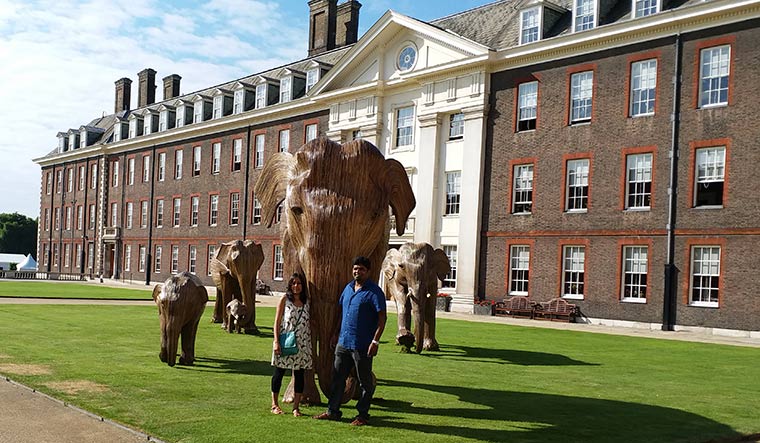 A mammoth undertaking: shubhra nayar and tarsh thekaekara with a few of the lantana elephants.