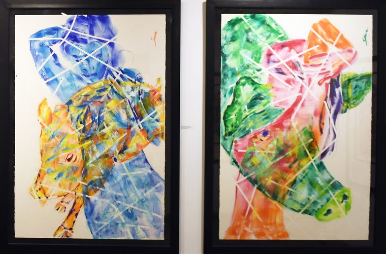 Two of his paintings from the exhibition