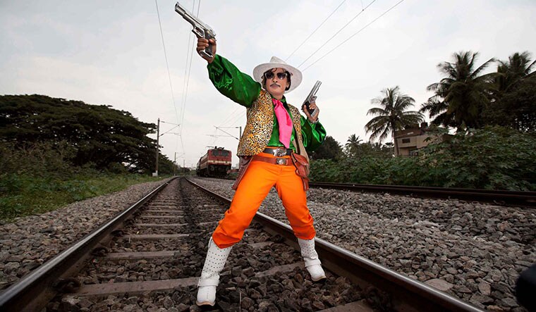 Photographer: INDU ANTONY A queer woman impersonates Quick Gun Murugan.