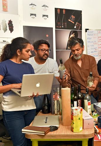 The team at the design consultancy, Lemon Design, working on a wine label | Anirudha Karmarkar