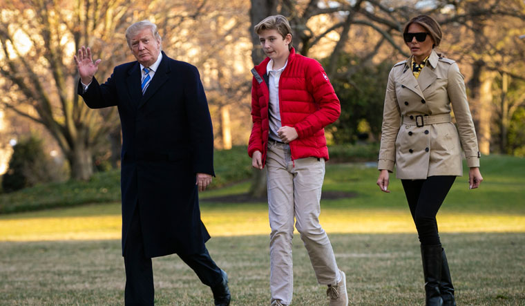 At home: US President Donald Trump with wife Melania and son Barron at the White House. Jordan says that in many ways the relationship between Trump and Melania is tight | Getty Images