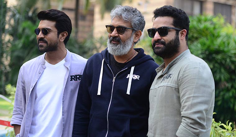 Power Pack: (From left) Ram Charan, S.S. Rajamouli and Jr NTR | AFP