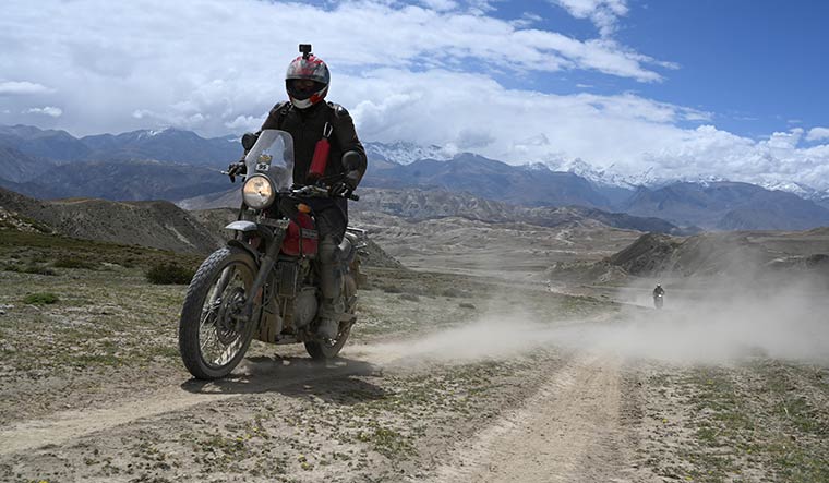 66-The-writer-riding-on-a-sandy-track-road-in-Lo-Manthang