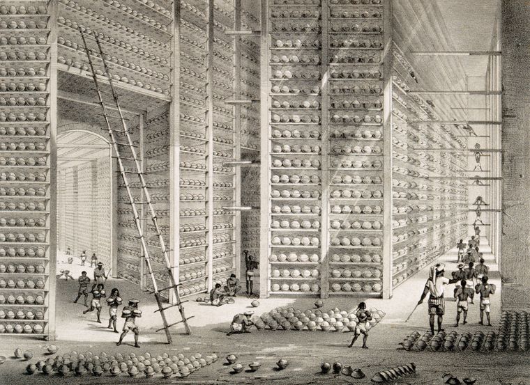 Sinful trade: A busy stacking room in an opium factory in Patna. Lithograph by W.S. Sherwill (1850) | Getty Images