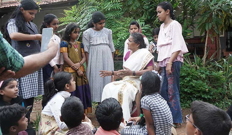 Stories live on: Child volunteers of the LoreKeeping project during a session with Pariyani P.T., a septuagenarian belonging to Cheruma community in Malappuram district | Klestin Joseph Chacko