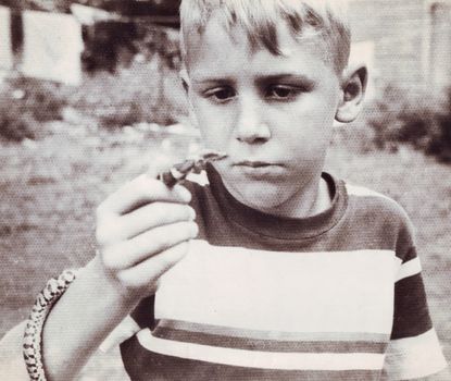 Living dangerously: Whitaker with his first snake, at Hoosick, New York, in 1947