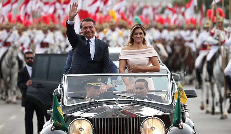 Right-wing's man: bolsonaro waves to supporters before his swearing in | Reuters