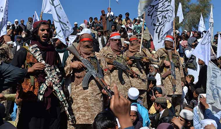 Guns and glory: Taliban militants in Laghman province celebrating the peace agreement | AFP