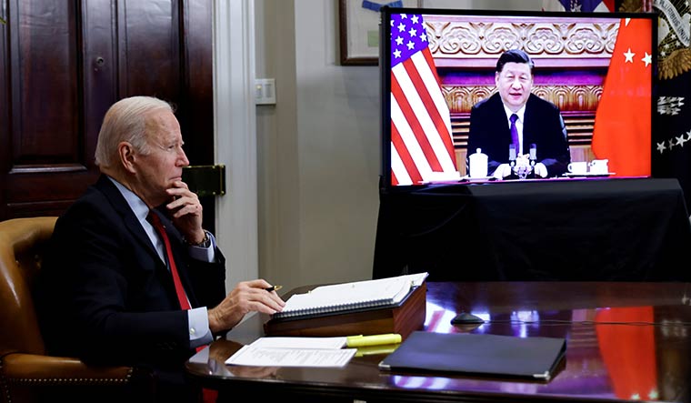Worlds apart: US President Joe Biden speaks virtually with Chinese President Xi Jinping from the White House | Reuters