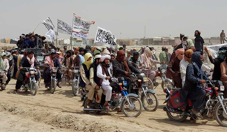Fear in the air: Supporters of the Taliban near the Friendship Gate crossing point in the Pakistan-Afghanistan border town of Chaman | Reuters