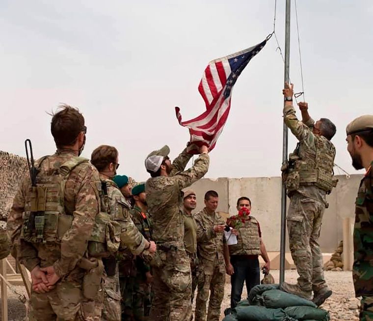 Leaving for good: American and Afghan soldiers attend a handover ceremony from the US Army to the Afghan National Army at Camp Anthonic in Helmand province, southern Afghanistan | AP