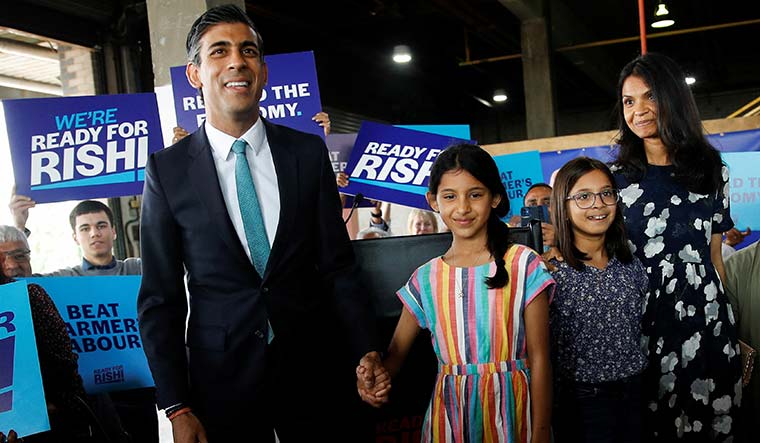 Staying together: Rishi Sunak, his wife Akshata Murty, and his daughters, Anoushka and Krishna, at a Conservative Party event | Reuters