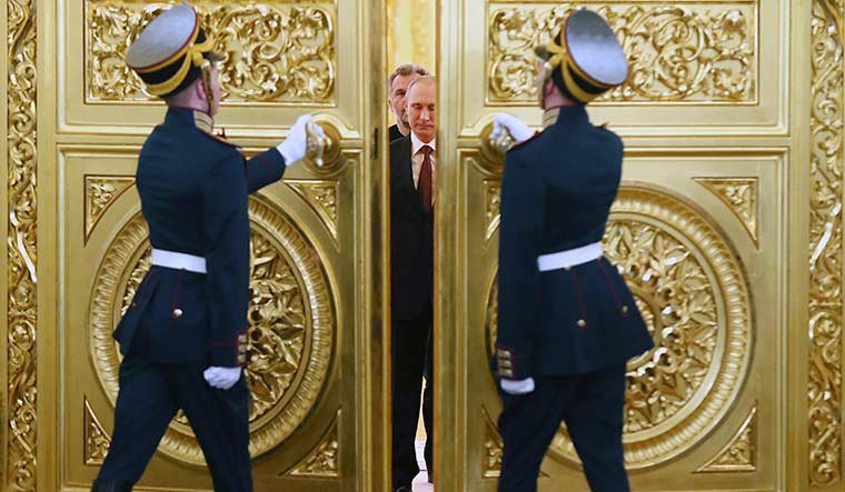 Hawkish moves: Russian President Vladimir Putin during the signing ceremony of a treaty for Crimea to join Russia in 2014 | AP