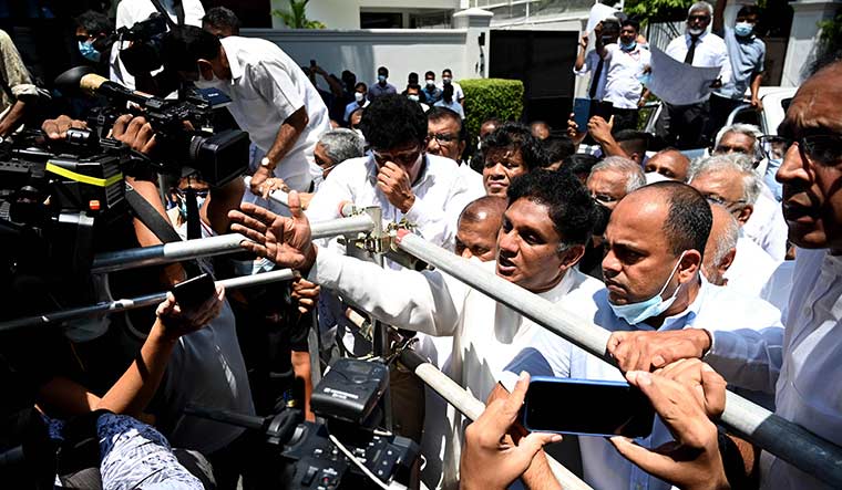 Anger sans barriers: Opposition leader Sajith Premadasa talks to the media during a protest in Colombo on April 3 | AFP