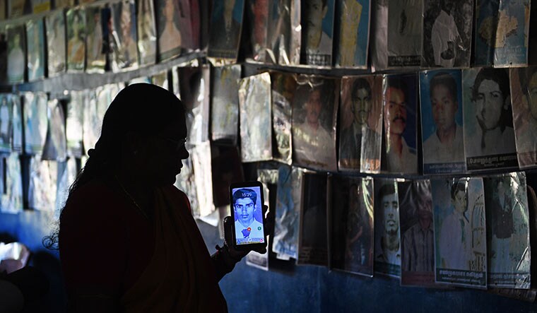 Agonising wait: Kokilavani with a photograph of her missing son, Kowrishankar, at the office of the Mothers of the Disappeared in Kilinochchi | Bhanu Prakash Chandra