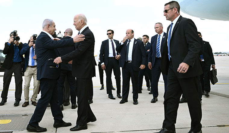 Mission impossible: Israel Prime Minister Benjamin Netanyahu greets US President Joe Biden upon his arrival at Tel Aviv’s Ben Gurion airport on October 18 | AFP