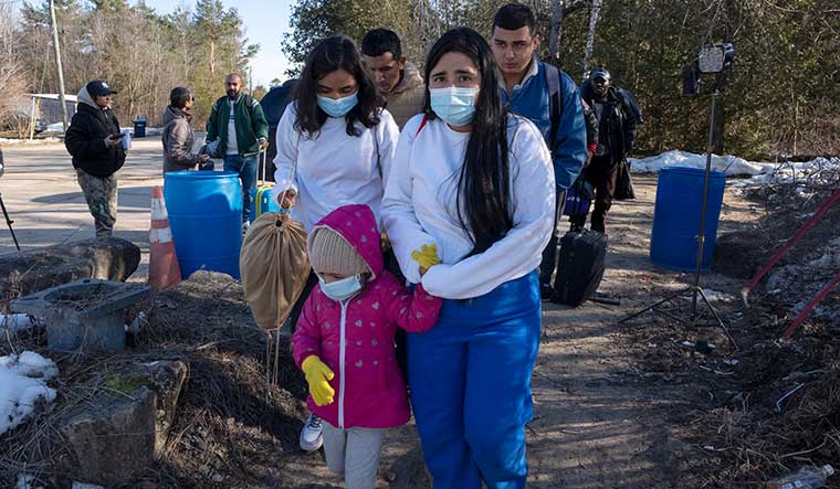Seeking shelter: Asylum seekers cross the border at Roxham Road from New York into Canada | AP