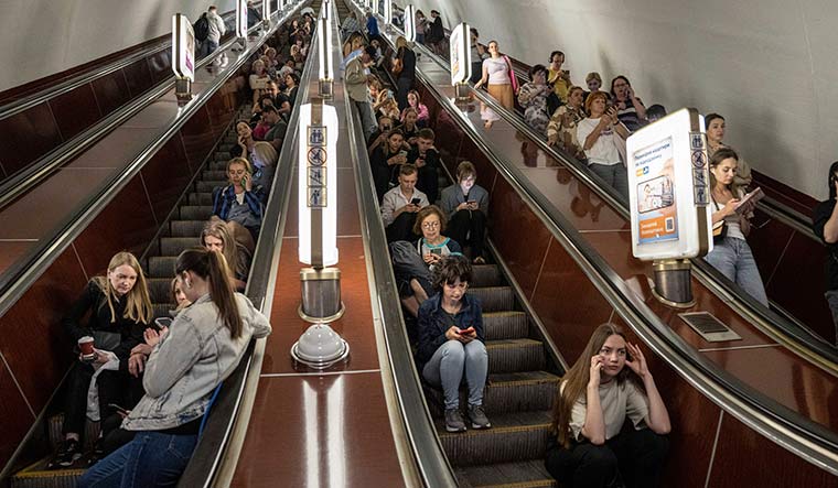 Silent resistance: People take cover at a metro station in Kyiv during a Russian rocket attack | AP