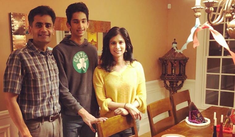 Family matters: Gita Gopinath with her husband, Iqbal, and son Rohil.